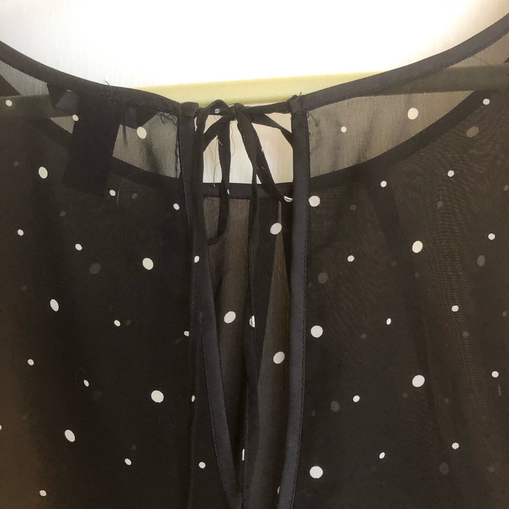 Black blouse with white polkadots